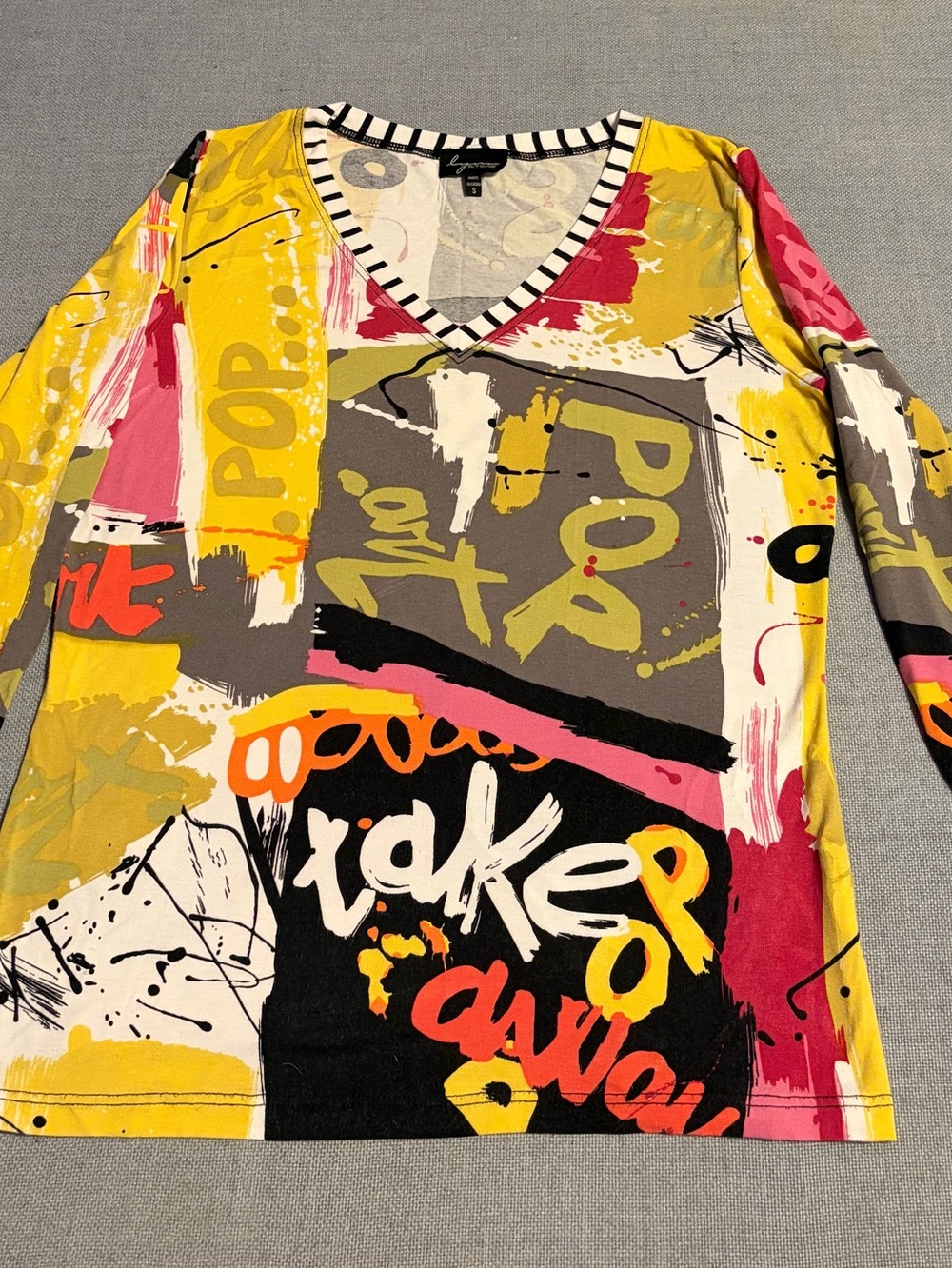 V-Neck Abstract Graphic Jersey Top in Yellow Multi - Unknown Brand